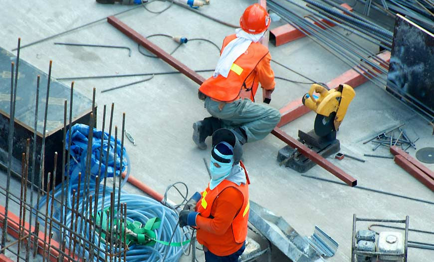 Two Men Working in a Factory Two Men Working in a Factory